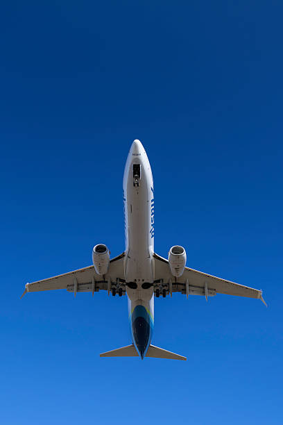 Portland, Oregon, USA - July 26, 2015: An Alaska Airlines 737 flies overhead upon landing at PDX.