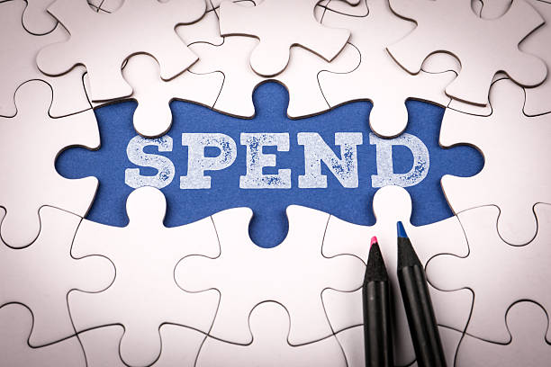 istock Word spend written on blue background under white puzzle pieces symbolizing finance budgeting money management and investment planning concept 2247022746