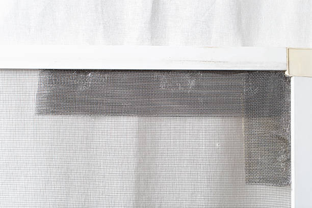 istock Window mosquito net. Repair of mosquito nets. 2247024376