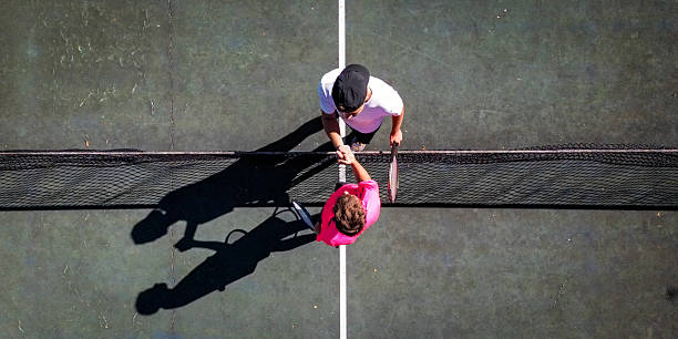 istock Tennis Instructor Teaching Young Student on Hard Court 2247028820