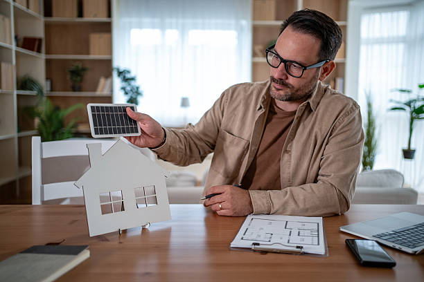 istock Man planning solar energy installation for home sustainability 2247030828