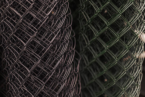 istock Rolled Sheets Of Metallic Wire Mesh With A Diamond Pattern, Showcasing Industrial Utility, Flexibility, And The Repetitive Geometry Of Manufacturing Materials 2247031926