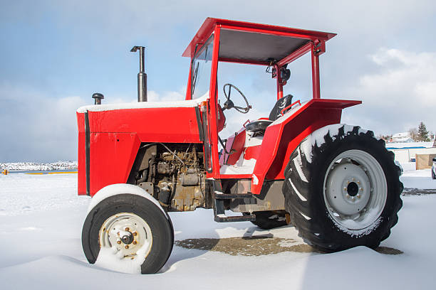 istock beautiful red tractor on a beautiful winter day 2247033656