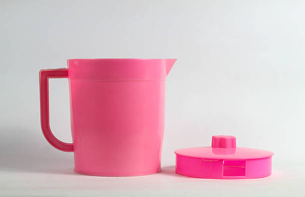 istock pink plastic teapot with open lid isolated on white background 2247039261