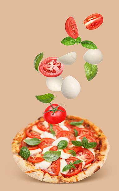 istock Caprese pizza and ingredients in air on dark beige background 2247043214