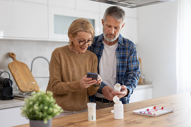 istock Couple Discussing Medication in Cozy Kitchen Setting 2247046796