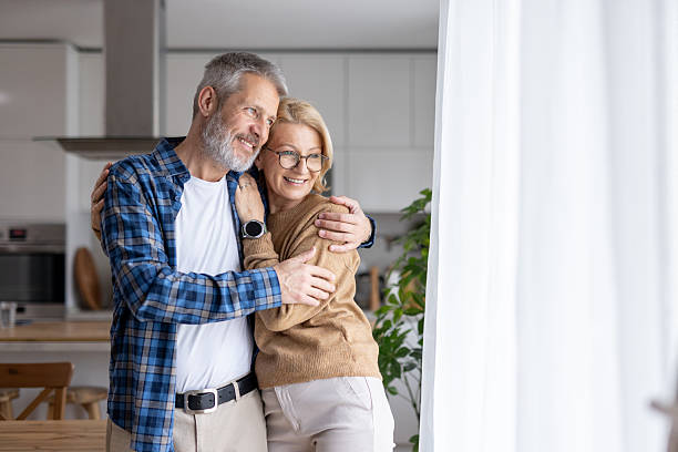 istock Couple embraces by the window, sharing a quiet moment 2247046800