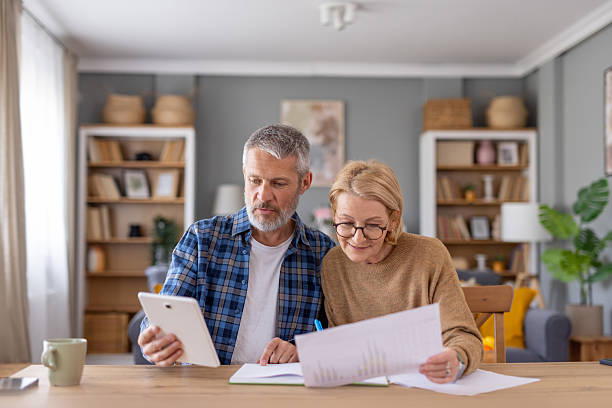 istock Husband and Wife Analyzing Financial Metrics in Cozy Space 2247046807