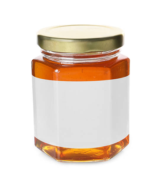 istock Jar of honey with blank label on white background. Mockup for design 2247049404