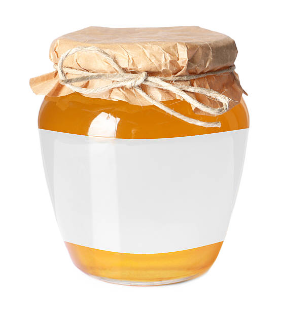 istock Jar of honey with blank label on white background. Mockup for design 2247049423