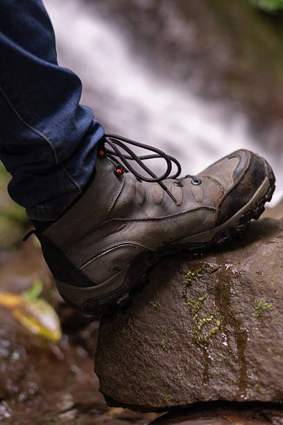 istock A Climber’s Boot on Rock with a Waterfall in the Background 2247051863