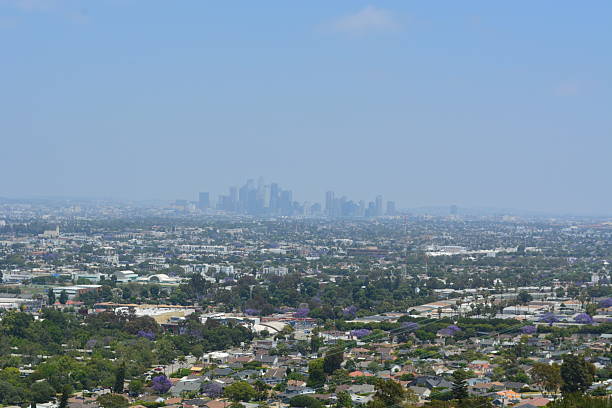 istock Scenic Overlook Reveals a Sprawling Cityscape With Distant Skyscrapers Under a Bright Blue Sky 2247059654