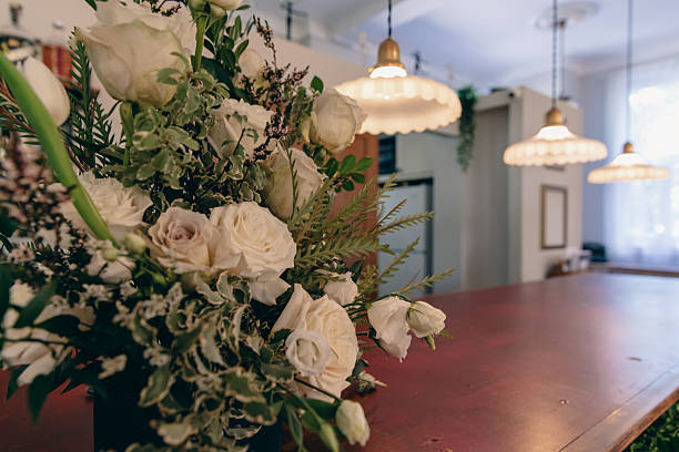 Soft artificial flowers in warm indoor lighting create a cozy and elegant home décor atmosphere, perfect for lifestyle, interior design, relaxation, and modern living themes.