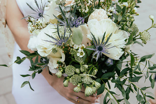 istock Bridal Bouquet With White Roses, Greenery, And Blue-Accent Florals For Wedding Day 2247065656