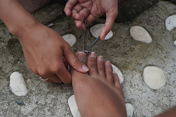 istock A wife cutting her husband's toenails 2247072246