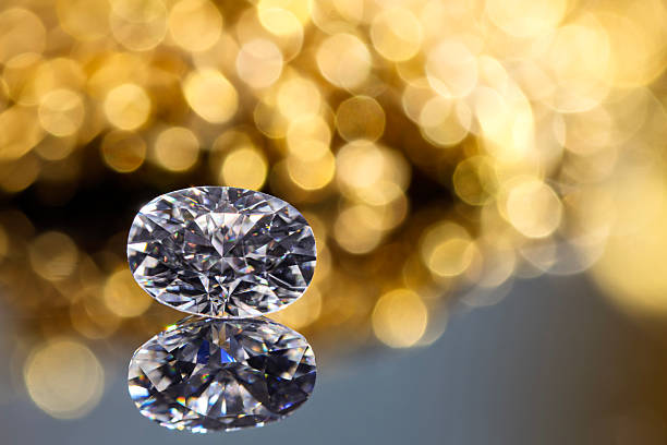 istock A diamond is sitting on a table with a blurry background 2247073080