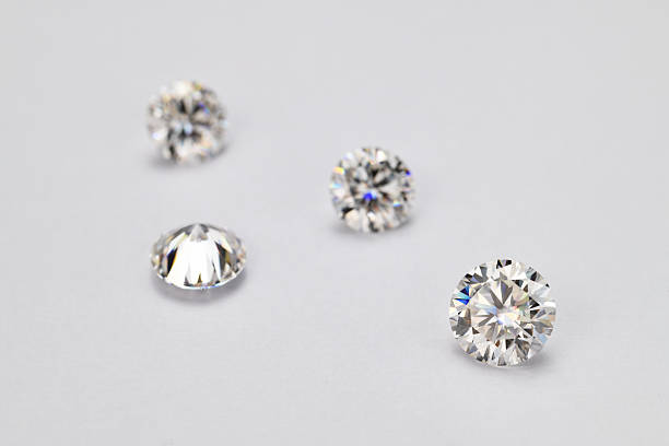 istock Four white diamonds are arranged in a row on a white background 2247073167