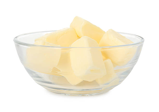 Butter in plastic container with knife