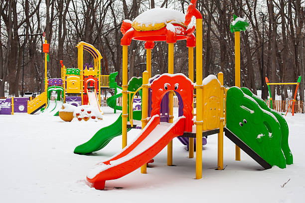 istock Empty snow children playground in the park in winter time 2247078948