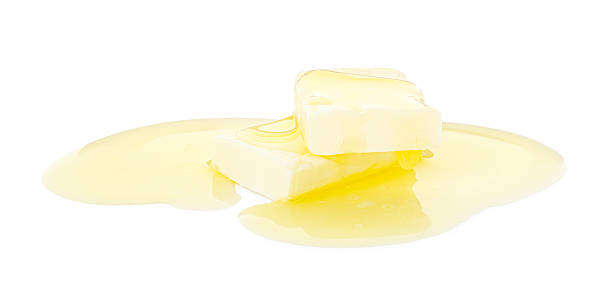 istock Pieces of melting butter isolated on white 2247079547