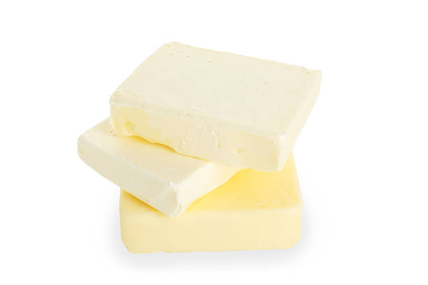 istock Stack of blocks of tasty butter isolated on white 2247079558