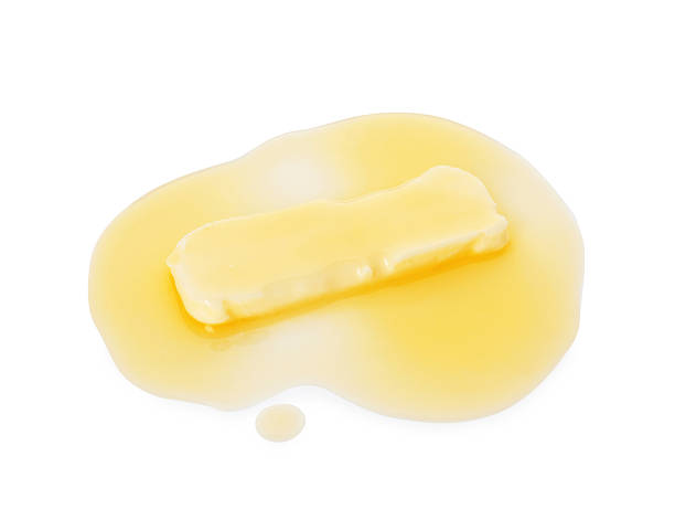 istock Piece of melting butter isolated on white, above view 2247079573