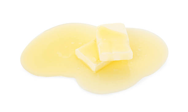 istock Pieces of melting butter isolated on white 2247079605