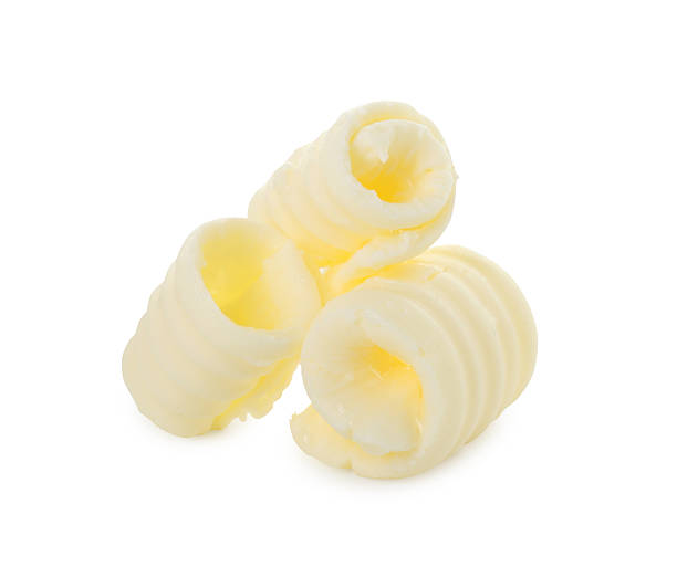 istock Three tasty butter curls isolated on white 2247079610