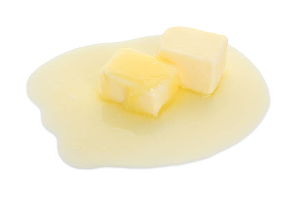 istock Pieces of melting butter isolated on white 2247079624