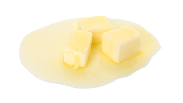 istock Pieces of melting butter isolated on white 2247079676