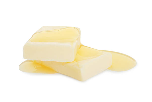istock Pieces of melting butter isolated on white 2247079684