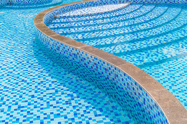 istock part of swimming pool with blue water 2247082420