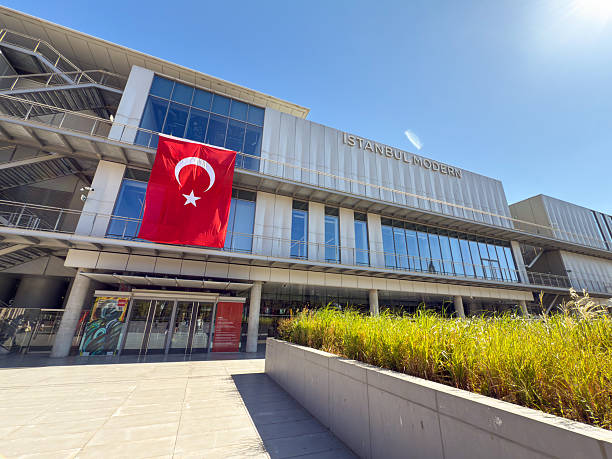 Istanbul, Turkey - August 28, 2025: Modern architecture of Istanbul Modern Museum with Turkish flag on facade