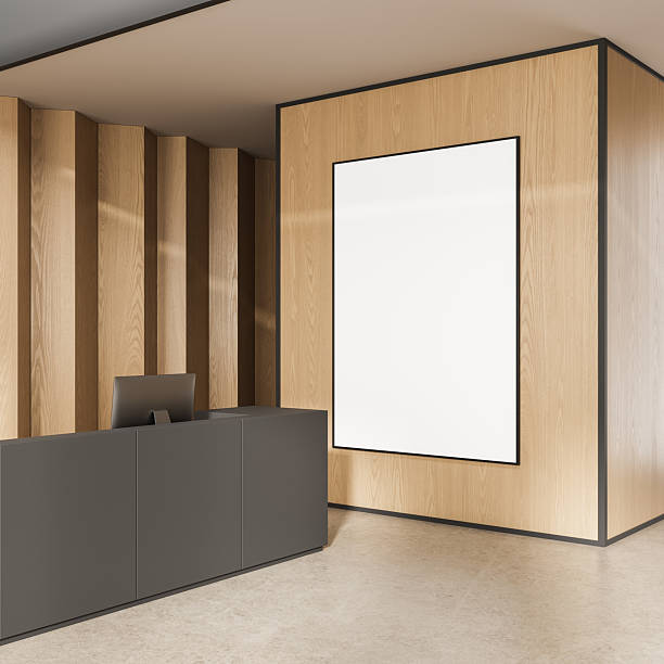 istock Modern reception area with blank vertical poster mockup on light wood wall in minimalist office interior design concept. 3D Rendering 2247085589