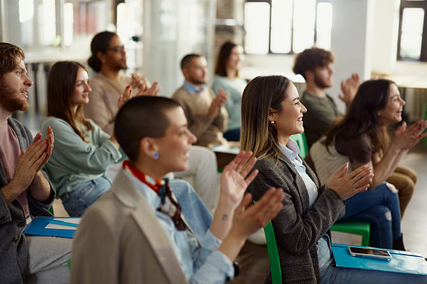 istock Happy freelancers applauding on a seminar in board room. 2247086229