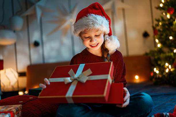 istock girl with Christmas gift 2247086720