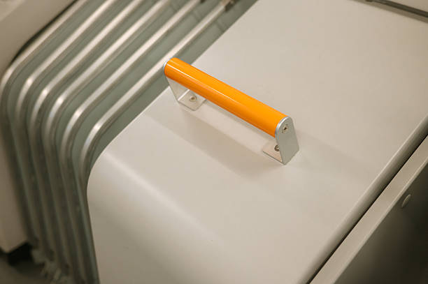 istock White metal machine with orange handle and industrial design elements 2247087531