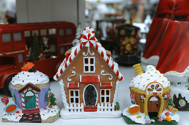 Festive gingerbread houses and cupcakes display with holiday decorations