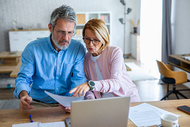 istock Stressed Couple Struggling With Financial Paperwork at Home 2247089839