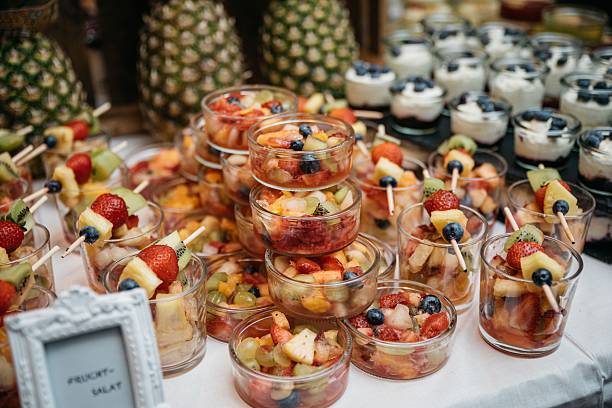 istock Assorted fruit salads and skewers on the buffet. 2247090797