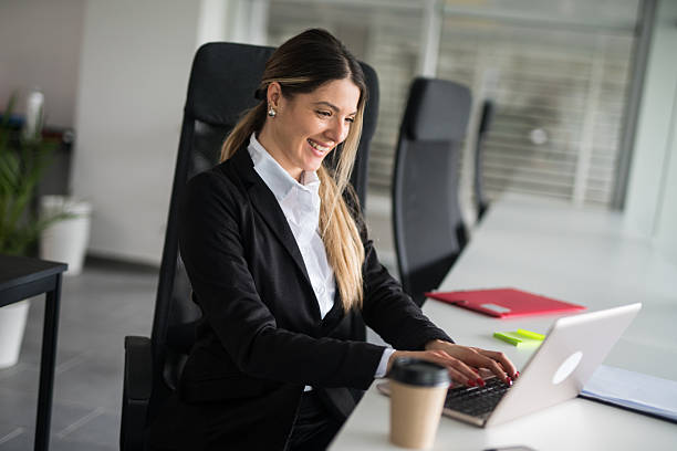 istock Businesswoman working on laptop in modern office 2247091419