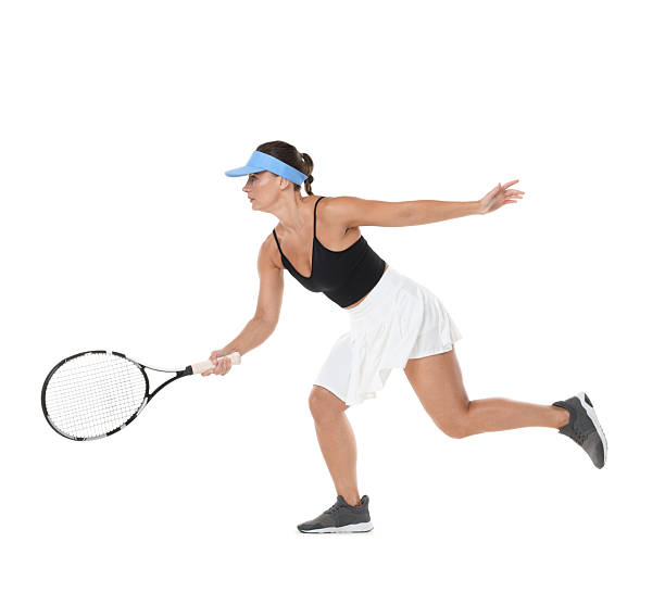 istock Woman with racket playing tennis on white background 2247095968