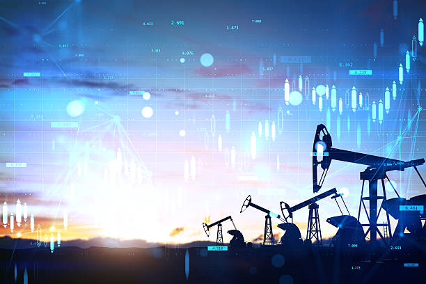 istock Oil pump jacks with financial data overlay at sunset on creative light background showing energy industry and stock market trends concept. 2247096660