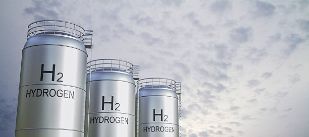 istock Hydrogen storage tanks with H2 markings under cloudy sky background for clean energy and industrial fuel concept. 3D Rendering. 3D Rendering 2247096734