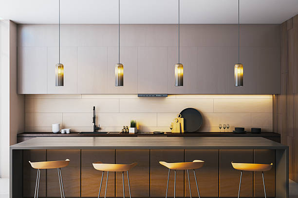 istock Modern minimalist kitchen interior with warm pendant lighting and sleek wooden surfaces in a neutral color palette. 3D Rendering 2247096748