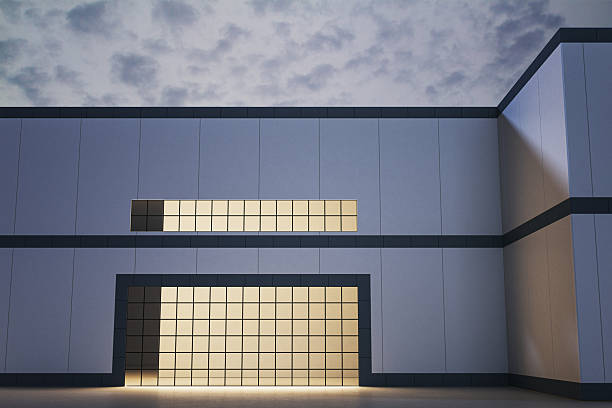 Contemporary building exterior with grid-lit facade, minimalistic design, under cloudy evening sky. Concept of modern architecture. 3D Rendering