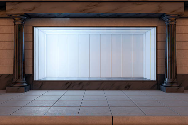 Blank storefront display with marble columns and tiled floor, modern clean background, illuminated for night retail branding concept, 3D Rendering