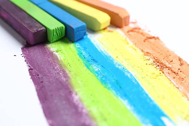 Colorful chalk pastels on white background, closeup