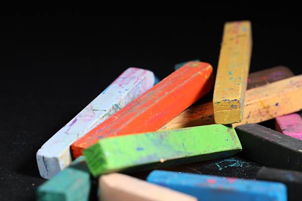 istock Colorful chalk pastels on black background, closeup 2247096870