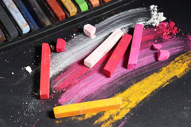 istock Many colorful chalk pastels on black background 2247096989